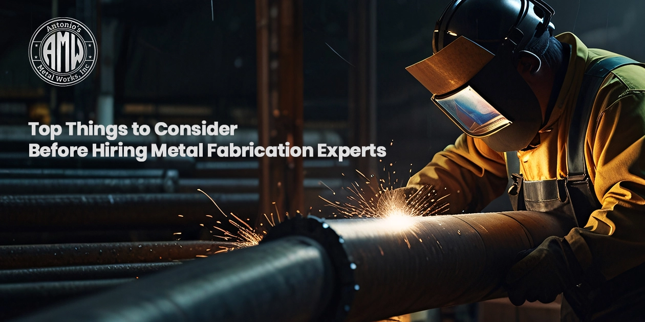 A professional welder working on industrial piping with precision, representing the skilled services provided by Metal Fabrication Experts.